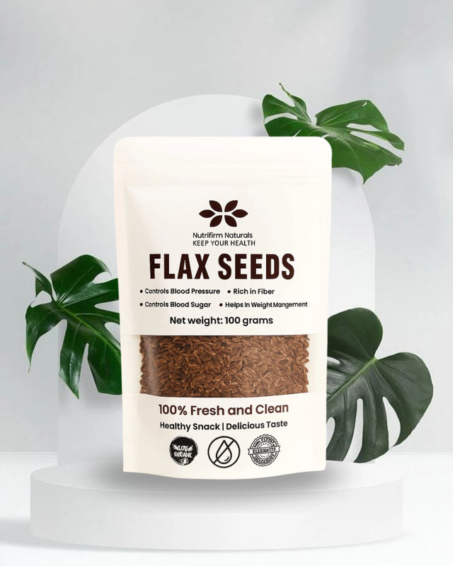 Bag of flax seeds with a label on a white background with green leaves.