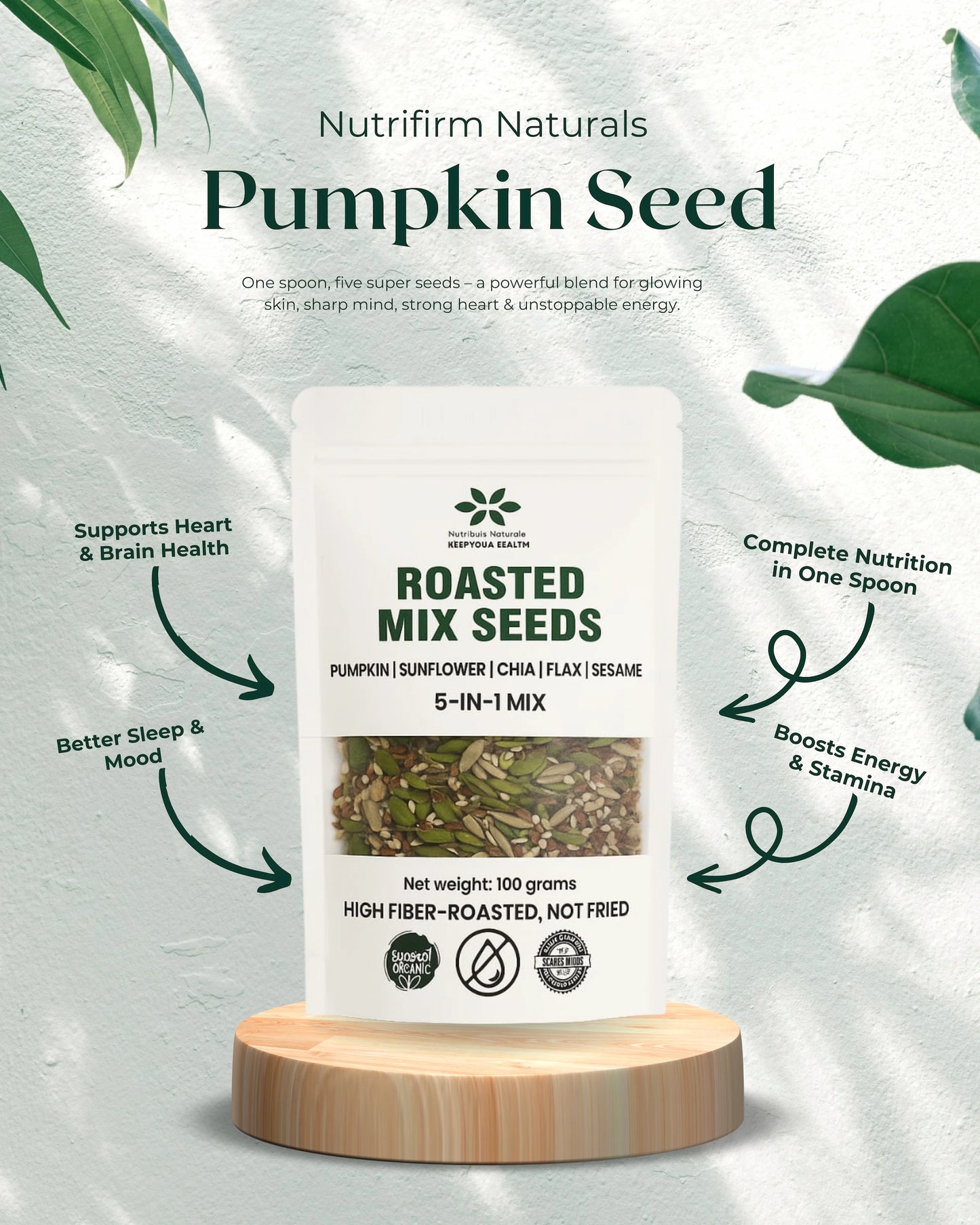 Nutrifirm Naturals Pumpkin Seed Roasted Mix Seeds packaging on a white background with green leaves.