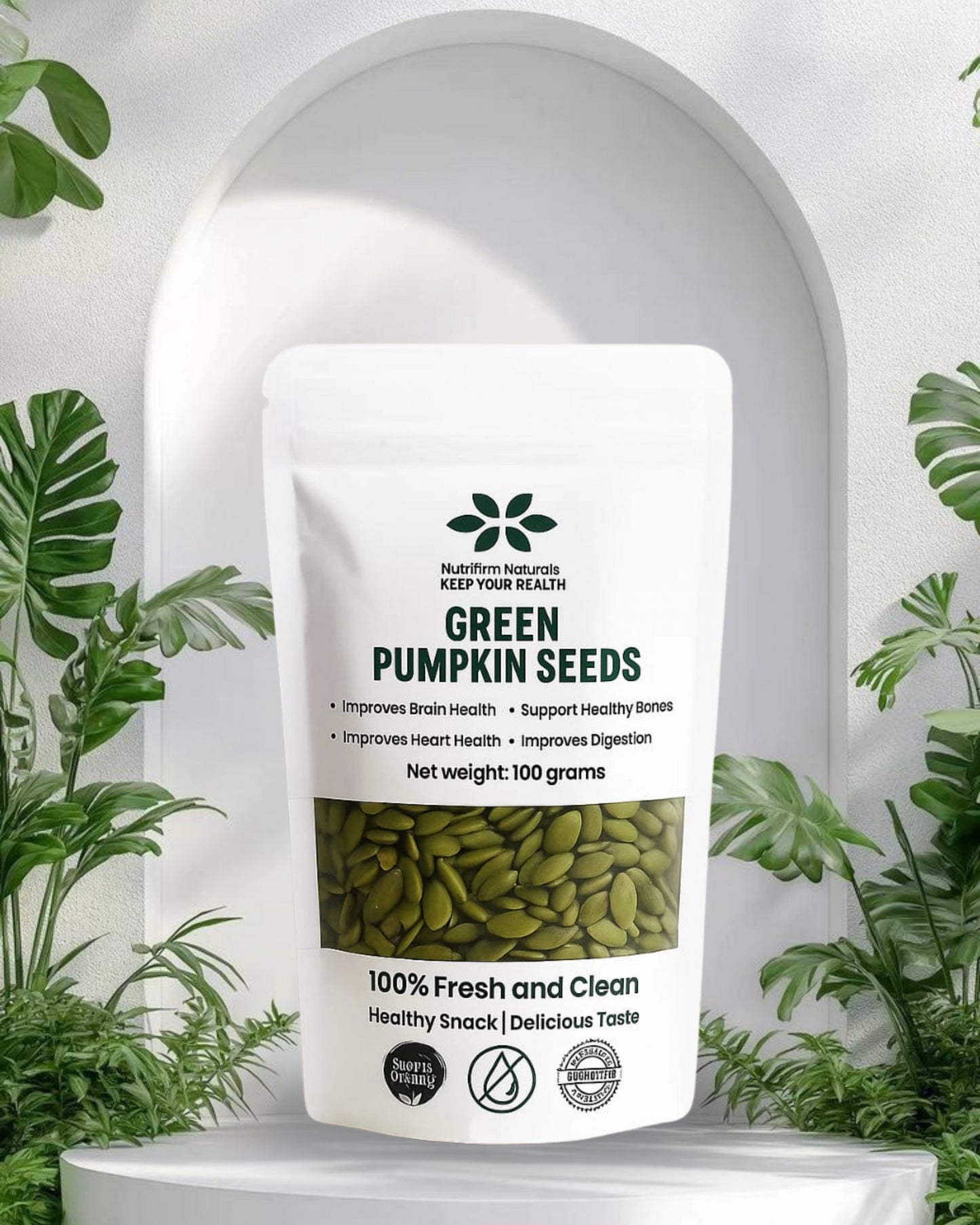 Package of green pumpkin seeds with a white background and green plants around
