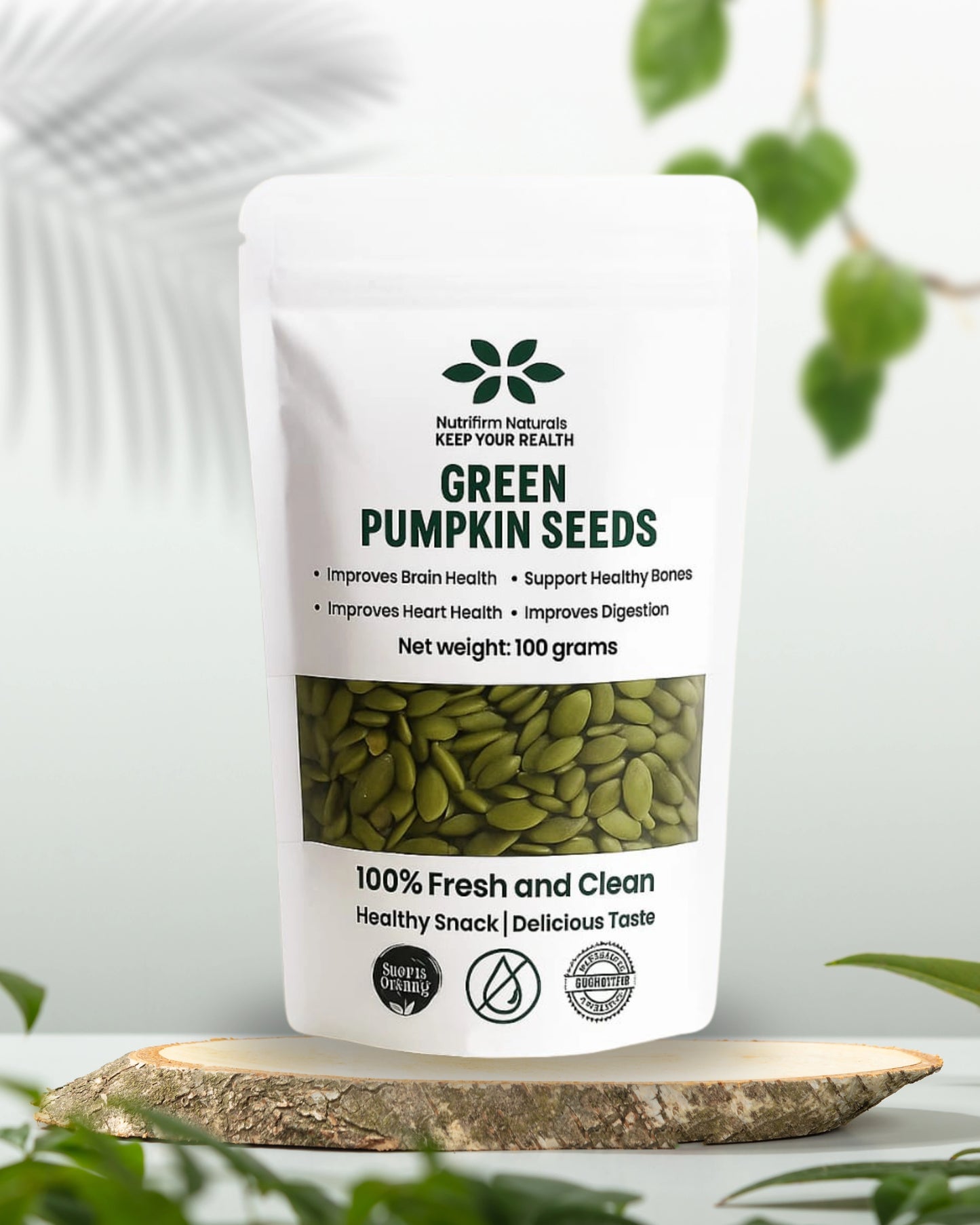 Bag of green pumpkin seeds on a white background with faded leaves