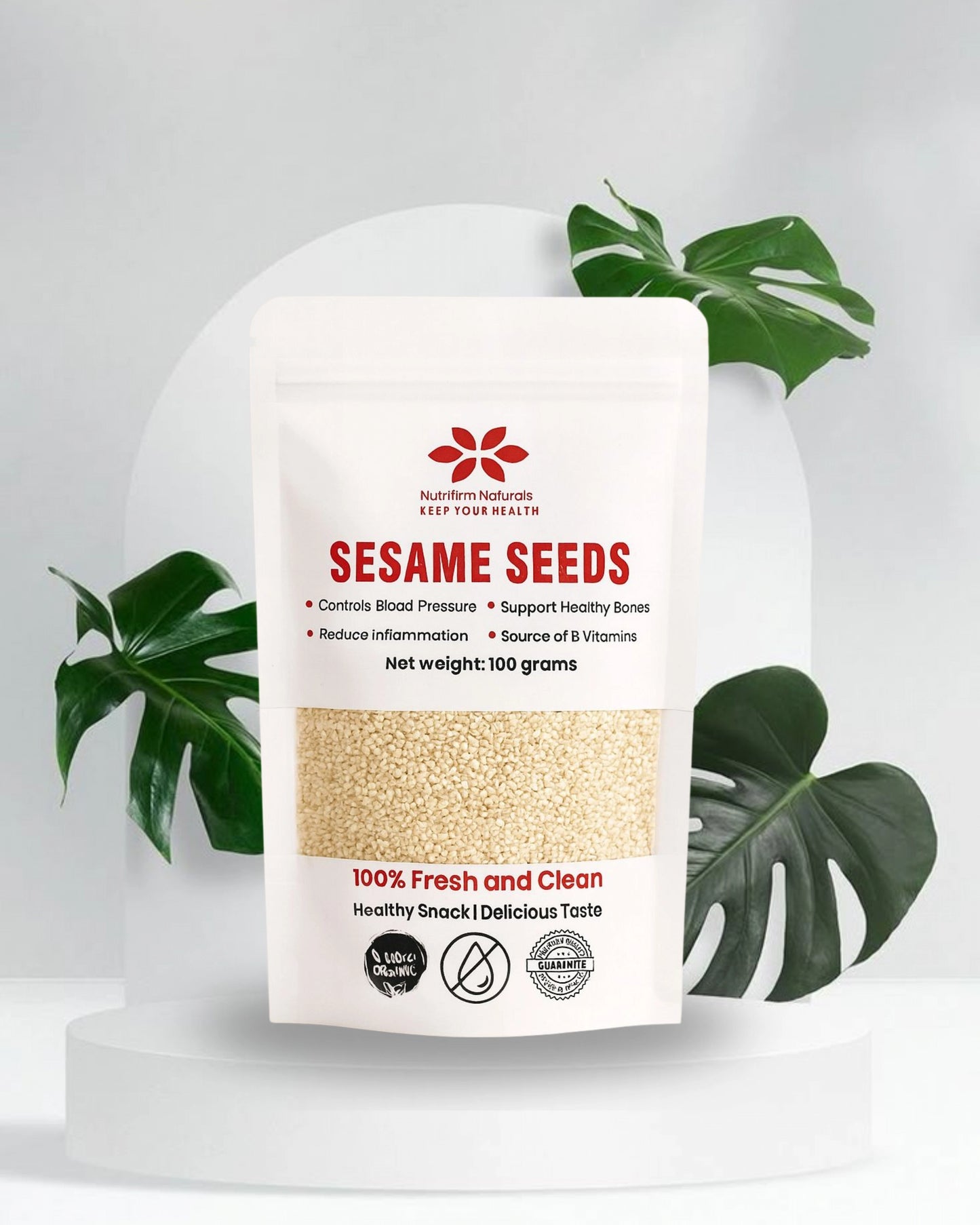 Package of Nutrifirm Naturals Sesame Seeds with green leaves in the background