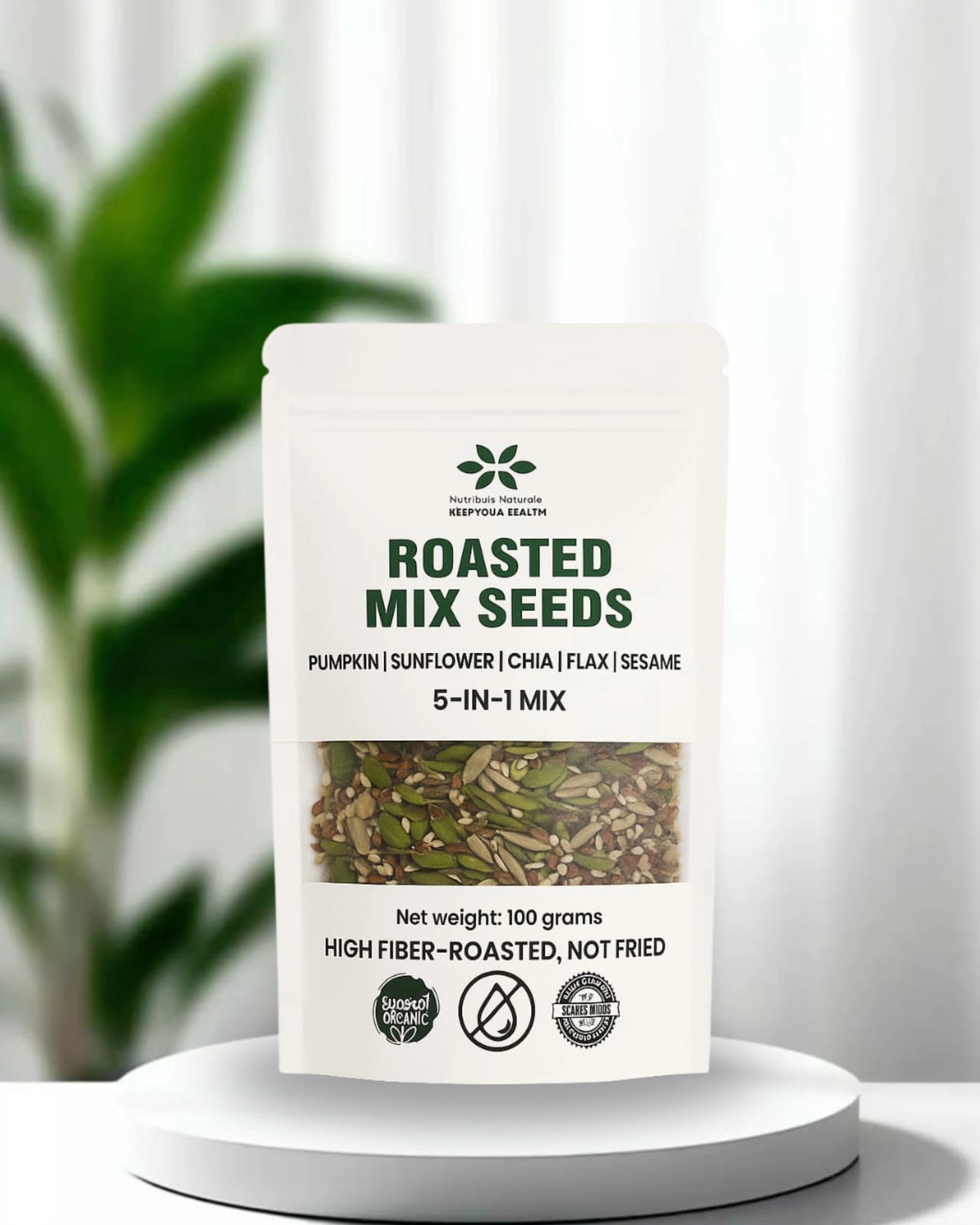 Roasted mix seeds packaging on a white background with a plant in the background