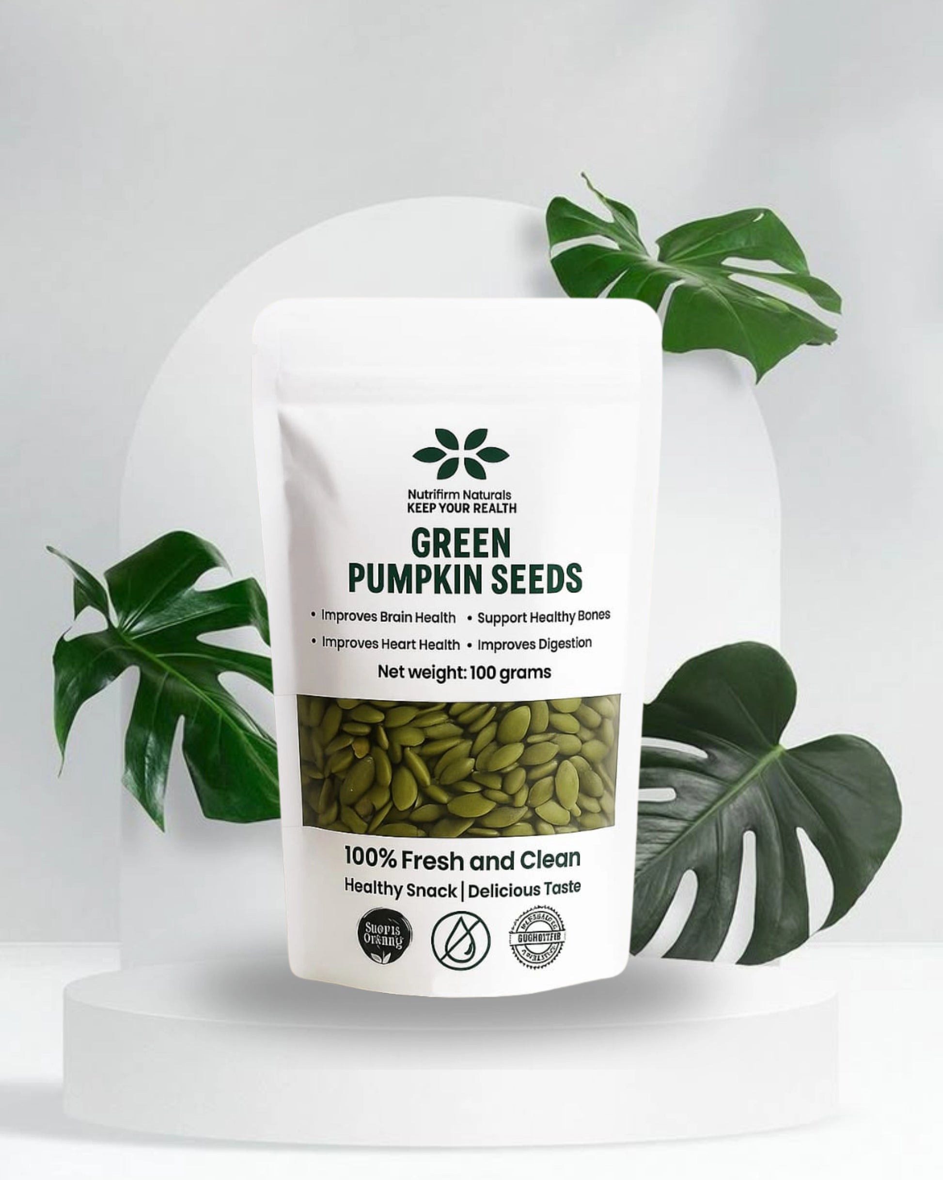Bag of green pumpkin seeds with a label on a white background with Leaves
